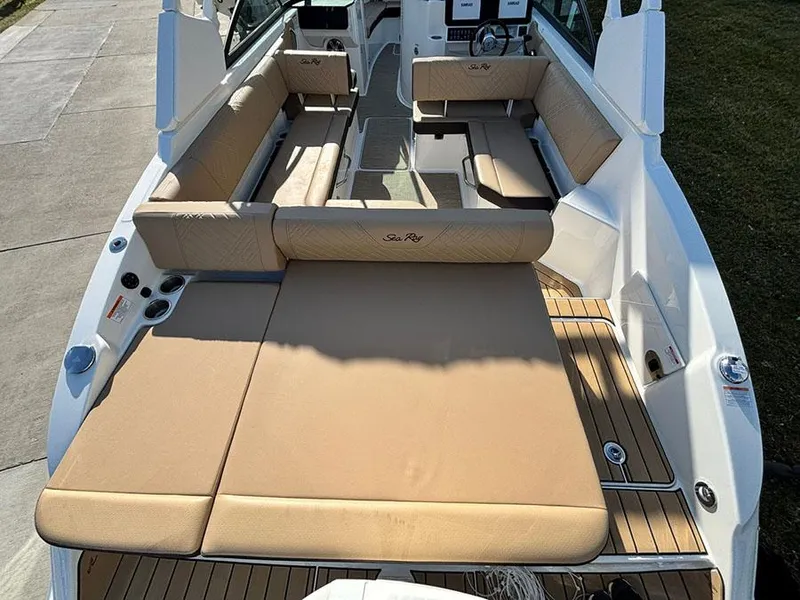 Slide: The Image of 2025 Sea Ray SDX 270 Outboard boat interior with spacious seating and sunbathing area. - 3