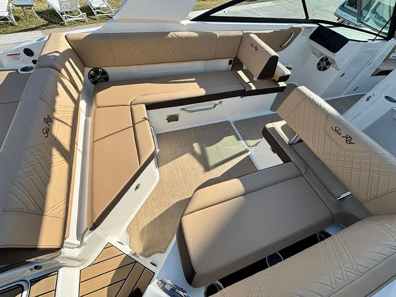 Slide: The Image of Luxurious seating on 2025 Sea Ray SDX 270 Outboard boat, featuring tan upholstery and spacious layout. - 5