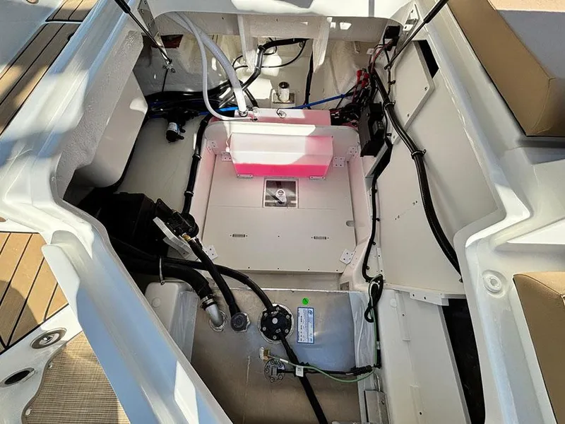 Slide: The Image of 2025 Sea Ray SDX 270 Outboard engine compartment with visible wiring and components. - 7