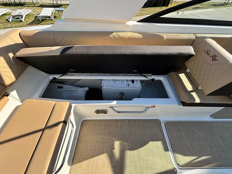 Slide: The Image of 2025 Sea Ray SDX 270 Outboard boat interior storage compartment with open seat. - 8