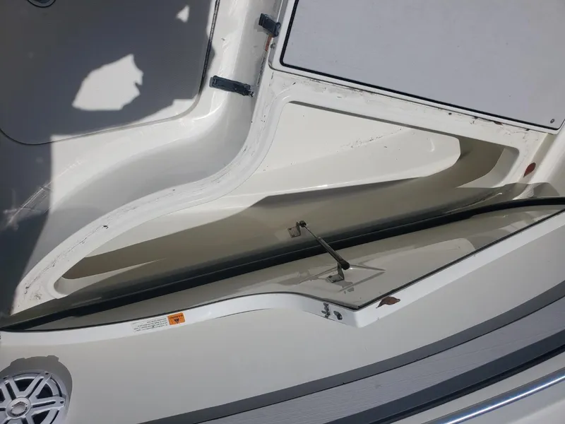 Slide: The Image of Open storage compartment on a 2003 Hydra-Sports 2400 CC Vector boat. - 12