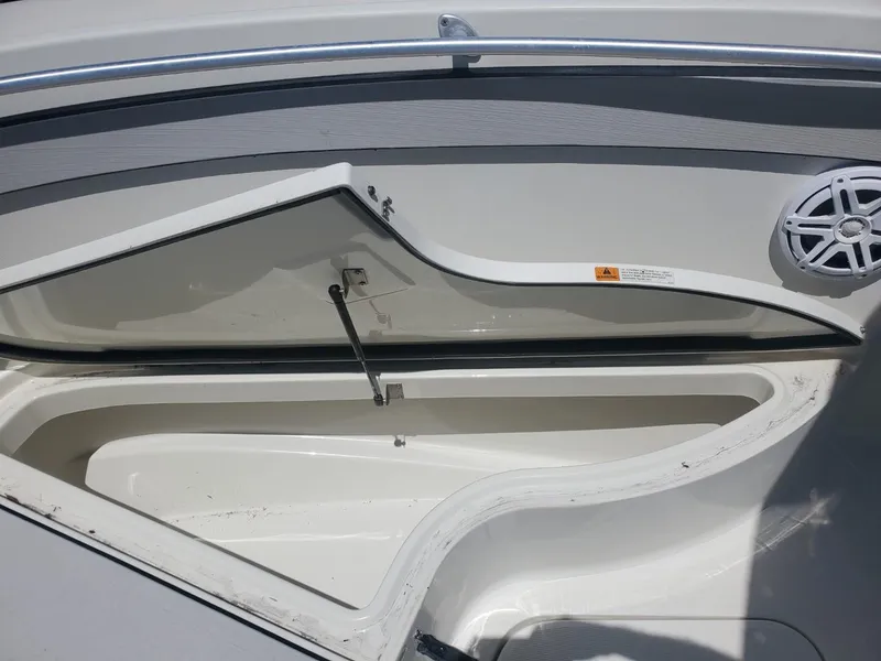Slide: The Image of Open storage compartment on a 2003 Hydra-Sports 2400 CC Vector boat. - 13