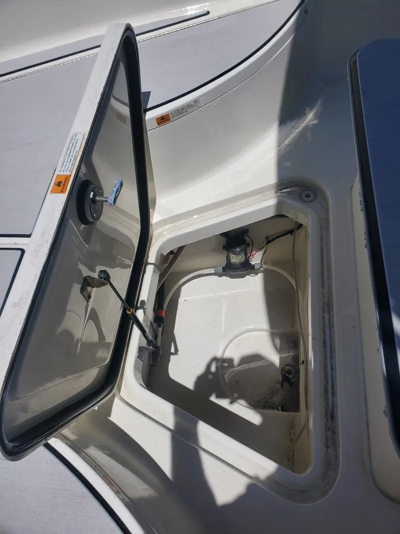 Slide: The Image of 2003 Hydra-Sports 2400 CC Vector boat storage compartment with open hatch. - 17
