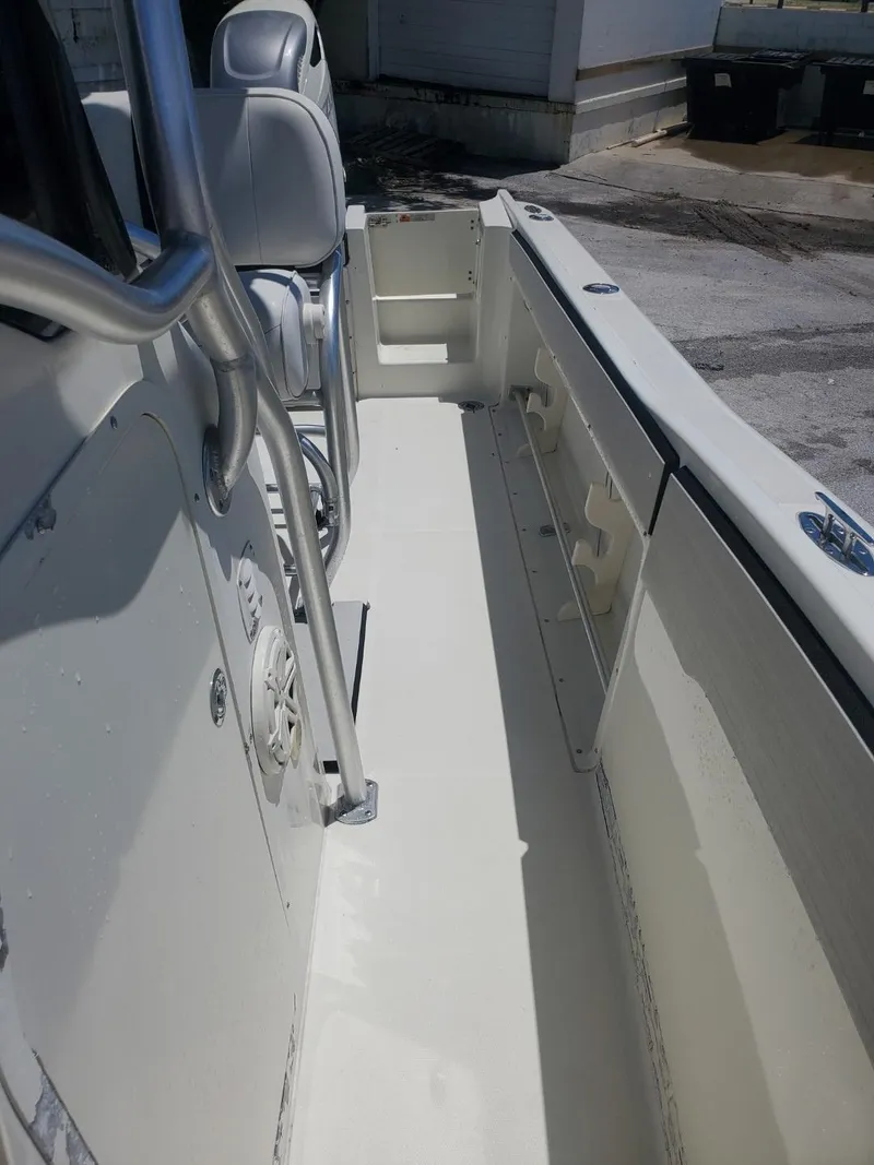 Slide: The Image of 2003 Hydra-Sports 2400 CC Vector boat interior, featuring seating and storage compartments. - 18