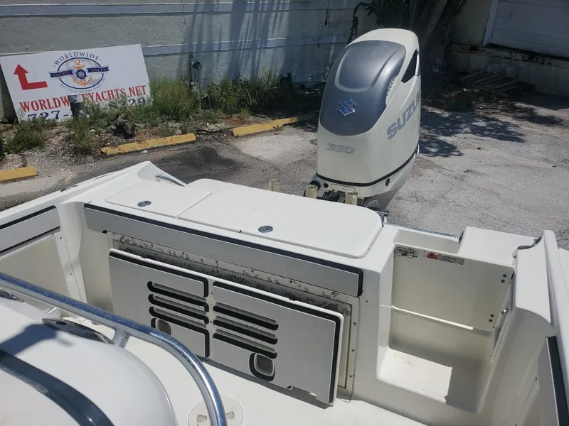 Slide: The Image of 2003 Hydra-Sports 2400 CC Vector boat with Suzuki outboard motor in a parking area. - 20
