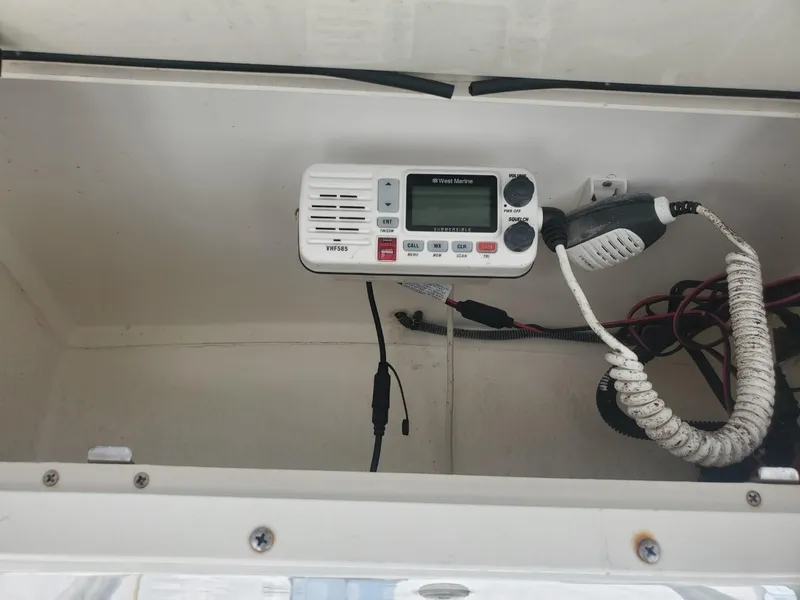 Slide: The Image of 2003 Hydra-Sports 2400 CC Vector boat radio compartment with communication equipment. - 23