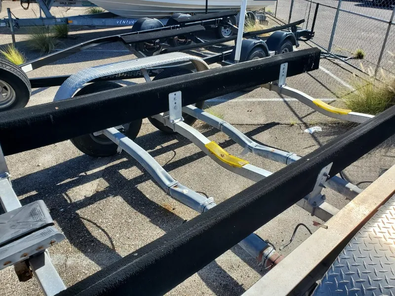 Slide: The Image of Boat trailer for 2003 Hydra-Sports 2400 CC Vector, parked in a lot. - 26