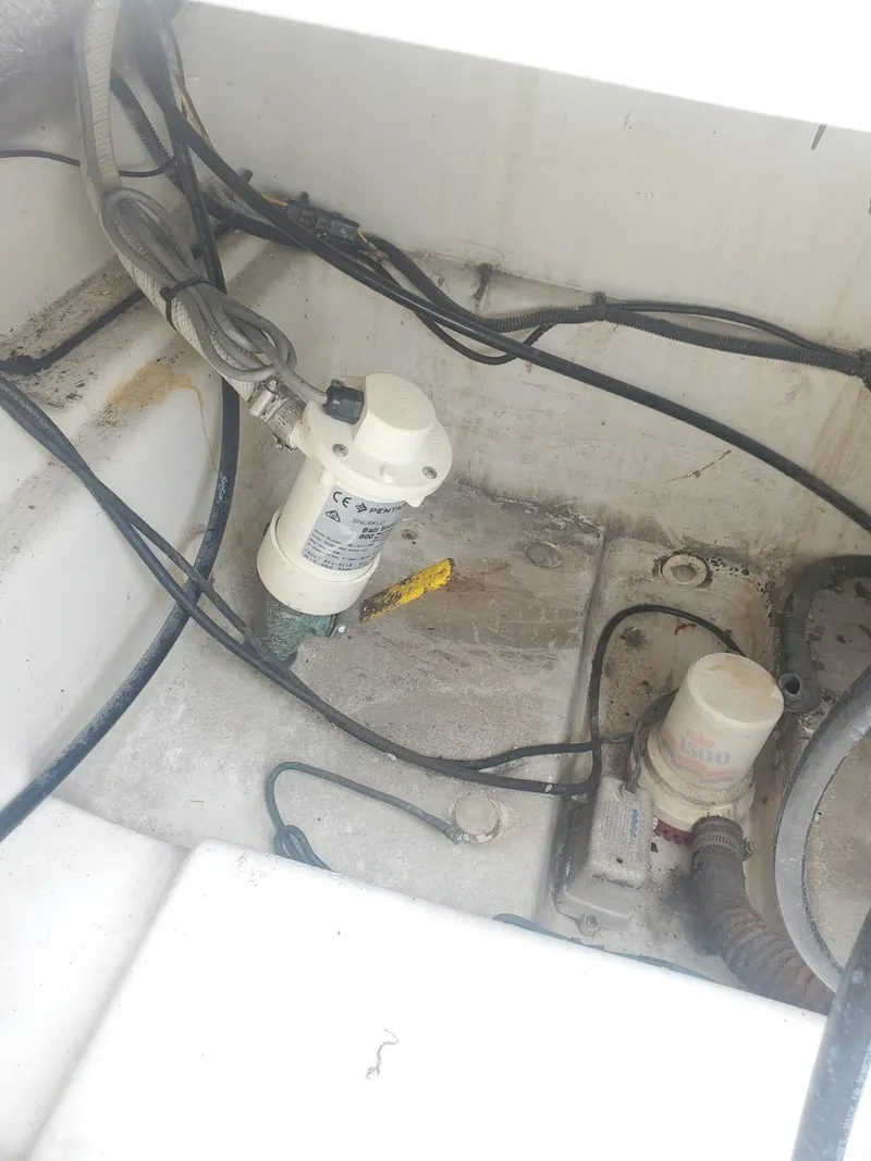 Slide: The Image of 2003 Hydra-Sports 2400 CC Vector boat bilge area with pumps and wiring. - 31