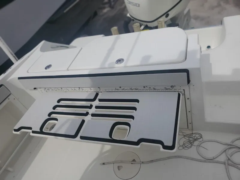 Slide: The Image of 2003 Hydra-Sports 2400 CC Vector boat deck with storage compartment and fishing rod holders. - 32