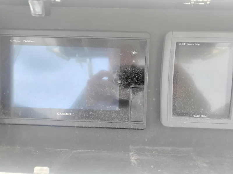 Slide: The Image of Garmin marine electronics on a 2003 Hydra-Sports 2400 CC Vector boat dashboard. - 33