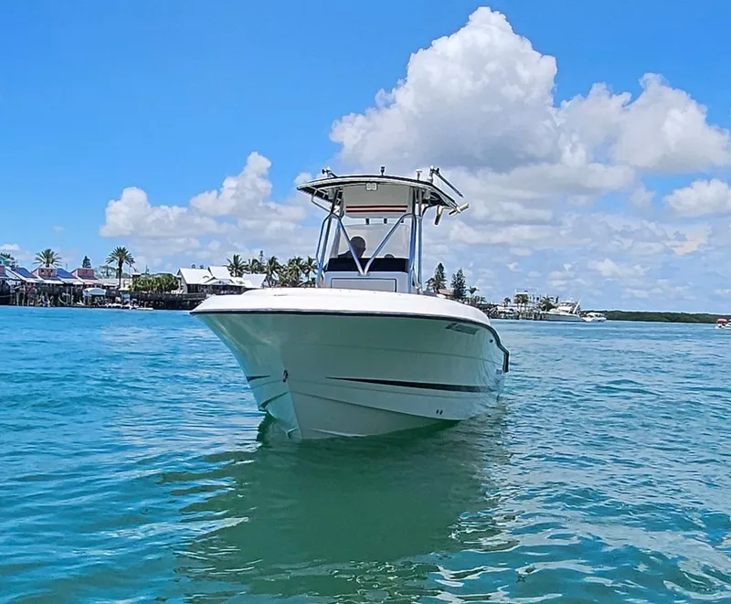 Slide: The Image of 2003 Hydra-Sports 2400 CC Vector boat on clear blue water under a sunny sky. - 4