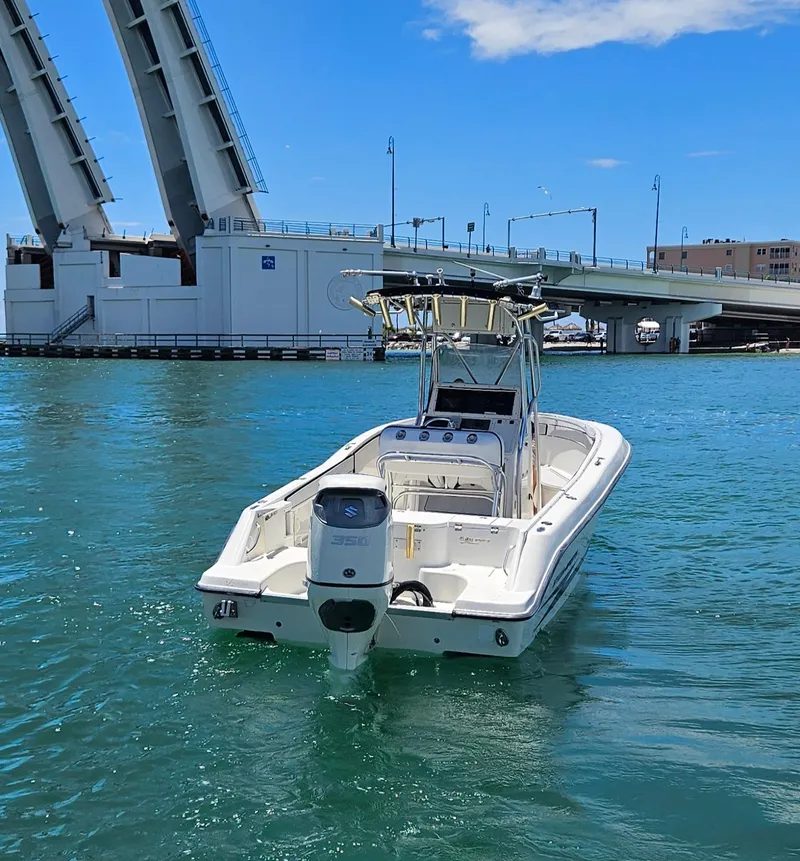 Slide: The Image of 2003 Hydra-Sports 2400 CC Vector boat on water near open drawbridge. - 6