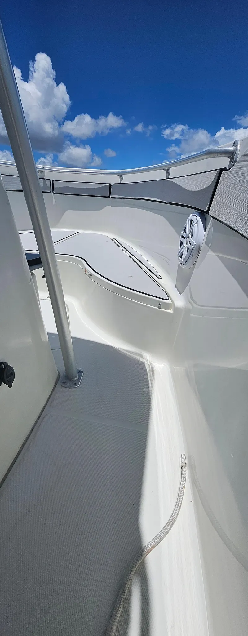 Slide: The Image of 2003 Hydra-Sports 2400 CC Vector boat deck under a clear blue sky. - 7