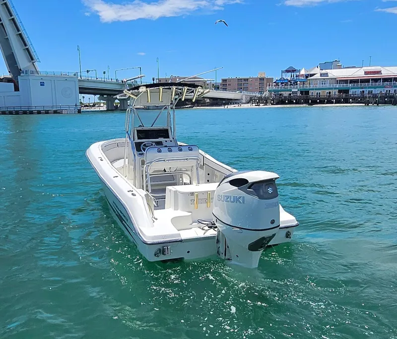 Slide: The Image of 2003 Hydra-Sports 2400 CC Vector boat on clear blue water near a bridge. - 8
