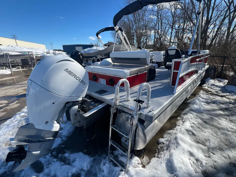 Slide: The Image of 2025 Princecraft Vectra 23 RL pontoon boat with Mercury outboard, parked on snowy ground. - 1