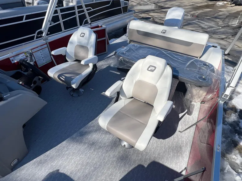 Slide: The Image of 2025 Princecraft Vectra 23 RL pontoon boat interior with plush seating and modern design. - 4