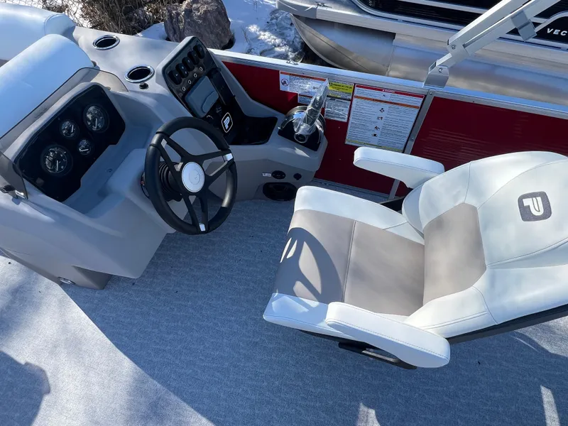 Slide: The Image of 2025 Princecraft Vectra 23 RL boat cockpit with steering wheel and captain's chair. - 5