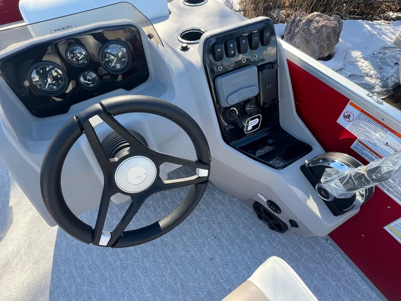 Slide: The Image of 2025 Princecraft Vectra 23 RL boat dashboard with steering wheel and control panel. - 6