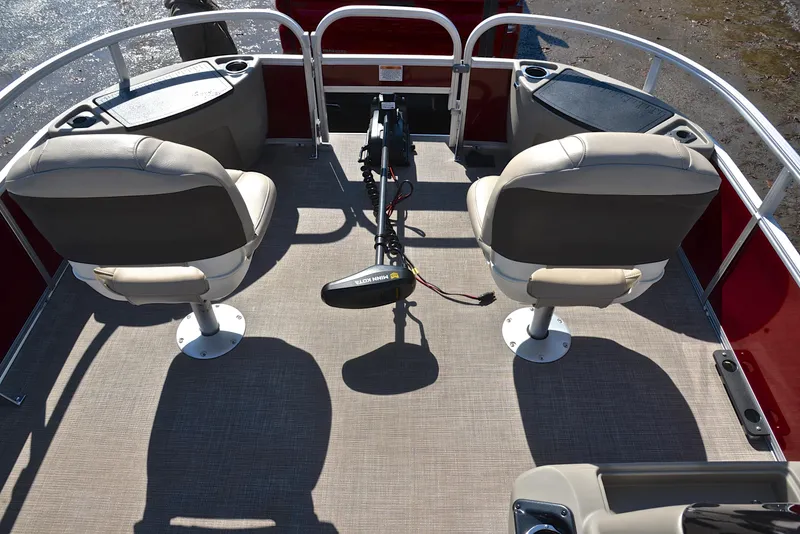 Slide: The Image of 2022 Sun Tracker BASS BUGGY 18 interior with two swivel seats and a trolling motor. - 22