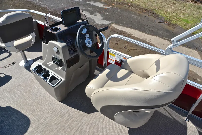 Slide: The Image of 2022 Sun Tracker BASS BUGGY 18 boat interior with steering console and seating. - 26