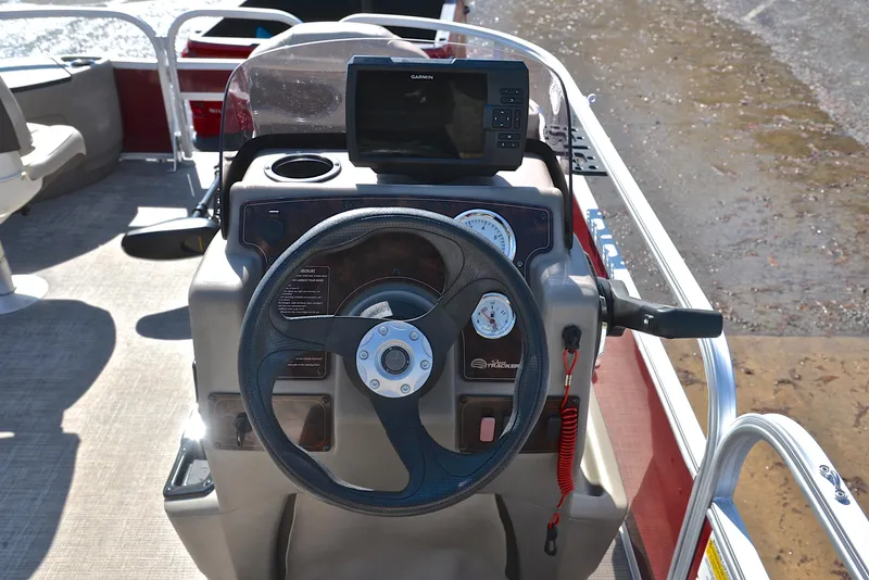 Slide: The Image of 2022 Sun Tracker BASS BUGGY 18 steering console with gauges and navigation system. - 27