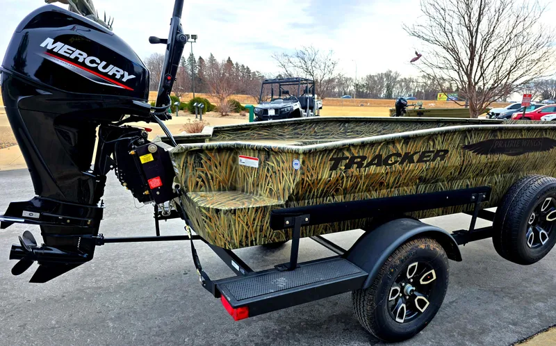 Slide: The Image of 2025 Tracker Grizzly 1650 T Prairie Wings Edition boat with Mercury outboard motor. - 4
