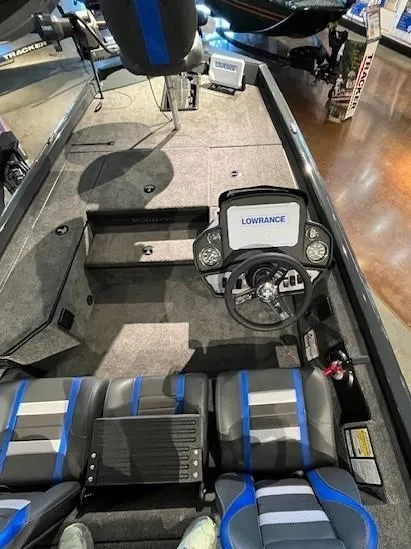 Slide: The Image of 2025 Ranger RT178 boat interior with Lowrance electronics and blue-accented seating. - 1