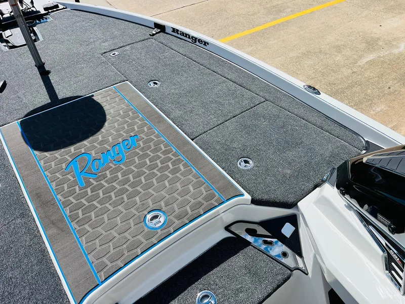 Slide: The Image of 2025 Ranger Z521R Cup-Equipped boat deck with logo and textured surface. - 19