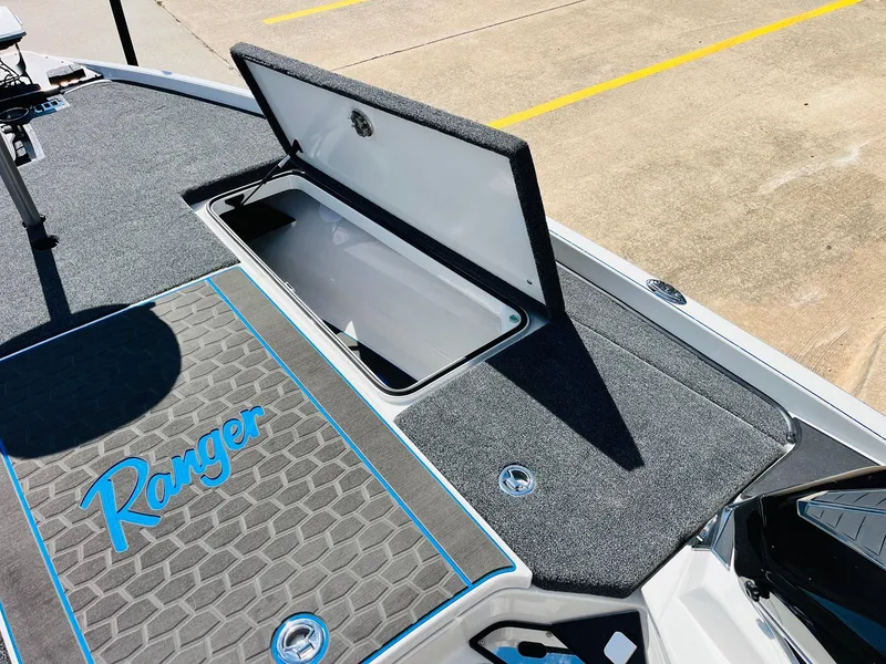 Slide: The Image of 2025 Ranger Z521R Cup-Equipped boat deck with open storage compartment. - 25