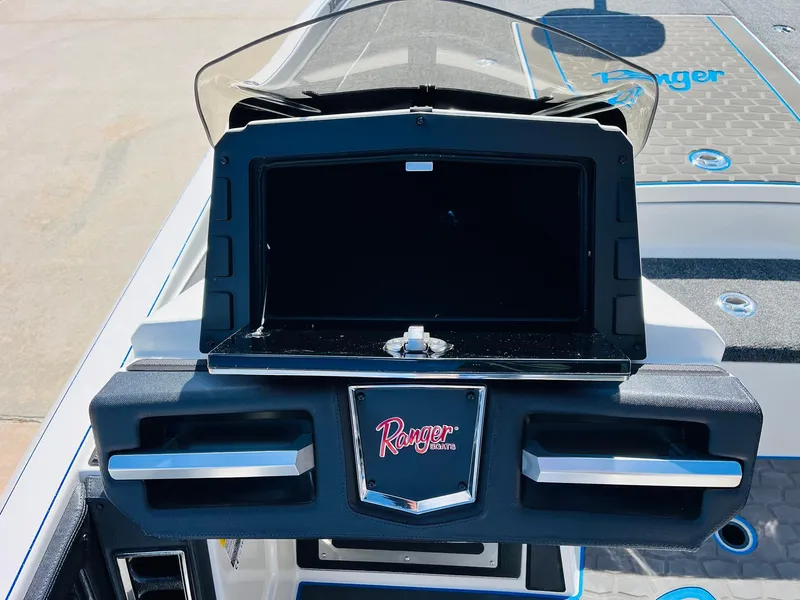 Slide: The Image of 2025 Ranger Z521R Cup-Equipped boat dashboard with storage compartment and logo. - 37