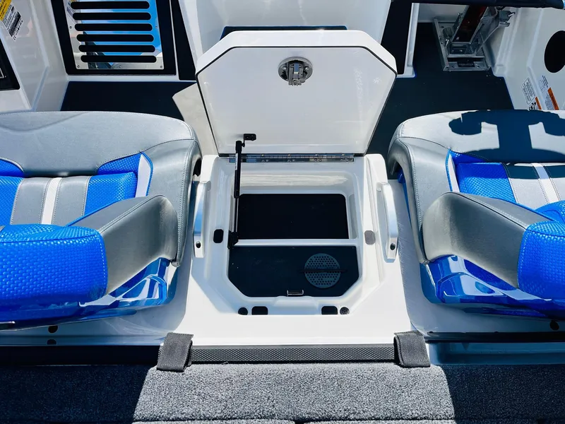 Slide: The Image of 2025 Ranger Z521R Cup-Equipped boat interior with blue seats and storage compartment. - 45