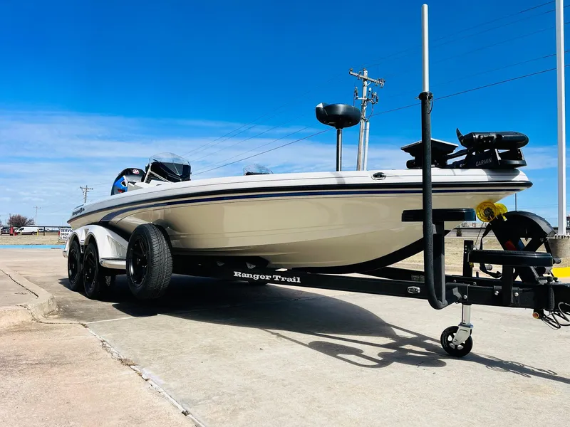 Slide: The Image of 2025 Ranger Z521R Cup-Equipped boat on trailer, parked outdoors under clear blue sky. - 5