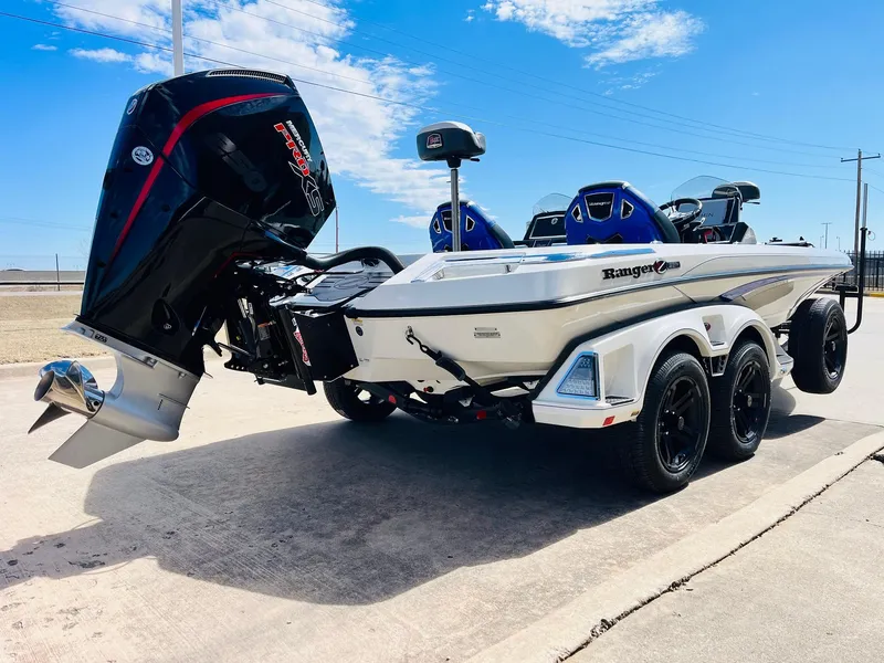 Slide: The Image of 2025 Ranger Z521R Cup-Equipped boat with powerful outboard motor on a trailer. - 8
