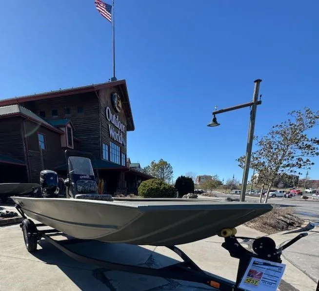 Slide: The Image of 2025 Tracker Grizzly 1860 CC boat displayed outside Outdoor World store. - 4