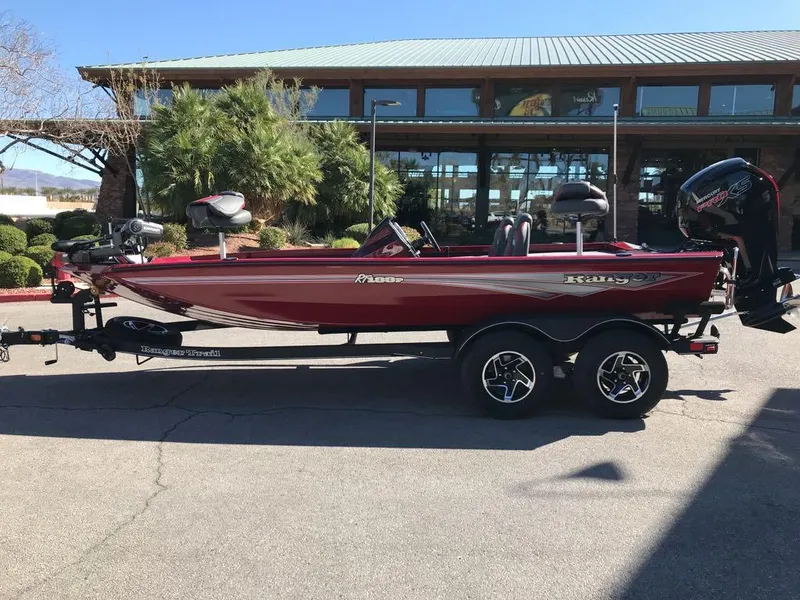 Slide: The Image of 2025 Ranger RT188P bass boat on trailer, parked outdoors. - 2