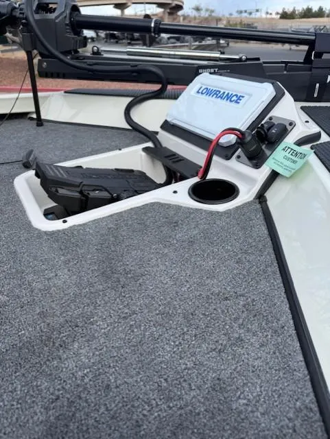 Slide: The Image of 2025 Ranger RT198P boat with Lowrance fishfinder and trolling motor on carpeted deck. - 13