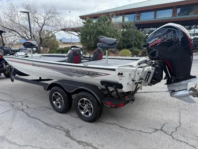Slide: The Image of 2025 Ranger RT198P boat with powerful engine on trailer, parked outdoors. - 2