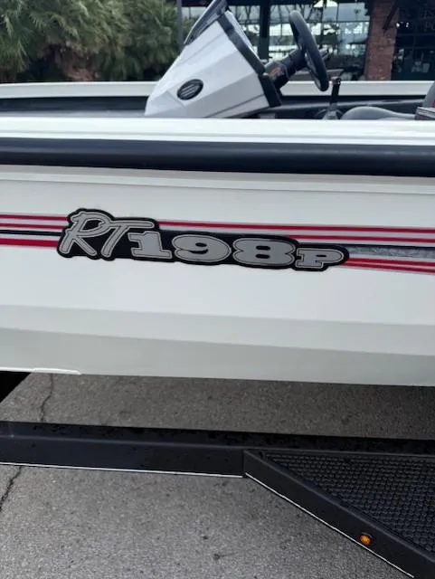 Slide: The Image of 2025 Ranger RT198P boat side view with model decal and steering wheel visible. - 3