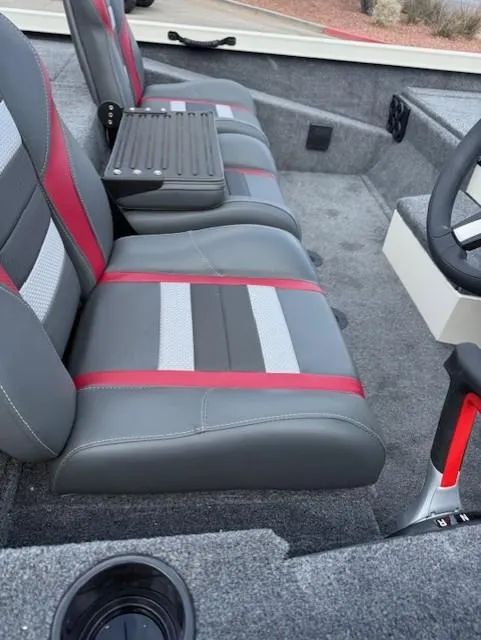 Slide: The Image of 2025 Ranger RT198P boat interior with gray and red seats, steering wheel, and carpeted flooring. - 5