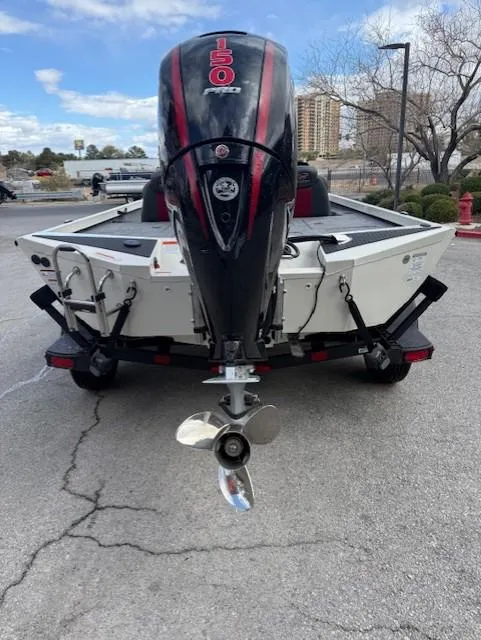 Slide: The Image of 2025 Ranger RT198P boat with powerful outboard motor, parked outdoors. - 6