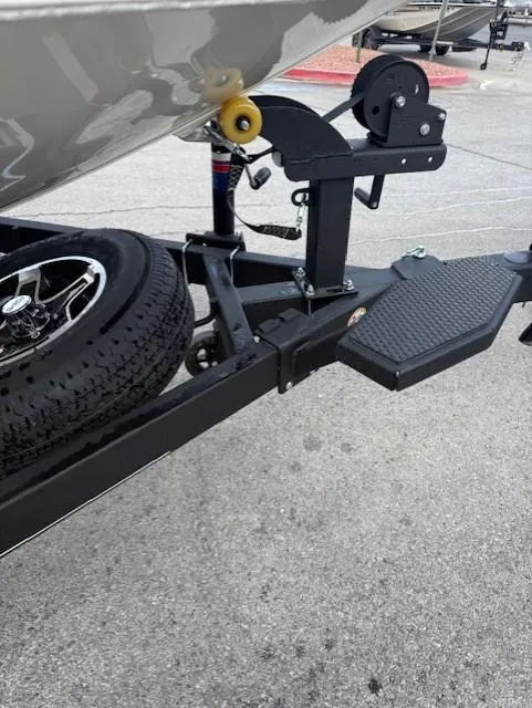 Slide: The Image of 2025 Ranger RT198P boat trailer hitch and wheel on pavement. - 7