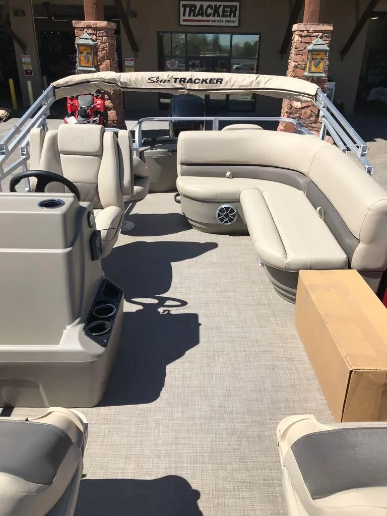 Slide: The Image of 2025 Sun Tracker Bass Buggy 18 DLX pontoon boat with spacious seating and modern design. - 8