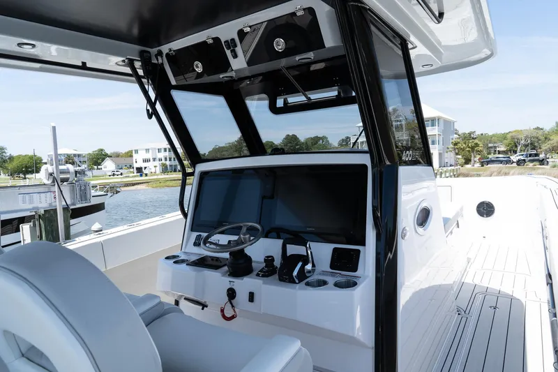 Slide: The Image of 2025 Twin Vee 400 GFX CC boat interior with modern helm and controls. - 28