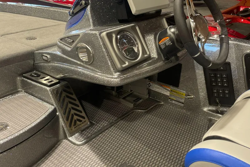 Slide: The Image of 2025 Caymas CX 20 PRO boat interior with steering wheel and dashboard controls. - 5