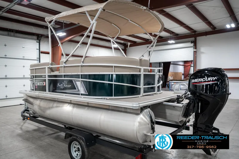 Slide: The Image of 2024 SunChaser 16 Vista pontoon boat with Mercury engine in showroom. - 10