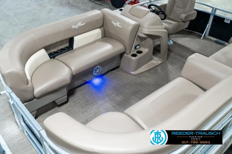 Slide: The Image of 2024 SunChaser 16 Vista pontoon boat interior with beige seating and blue LED lighting. - 12