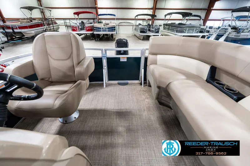 Slide: The Image of 2024 SunChaser 16 Vista boat interior with beige seating and carpeted floor. - 18