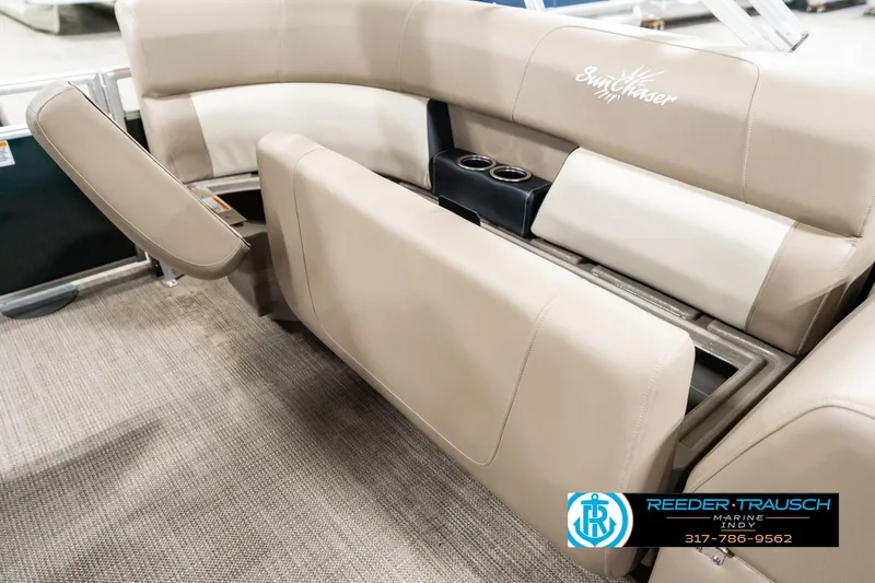 Slide: The Image of 2024 SunChaser 16 Vista boat interior with beige seating and cup holders. - 25
