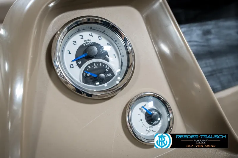 Slide: The Image of Dashboard gauges of 2024 SunChaser 16 Vista boat, featuring speedometer and fuel indicators. - 30