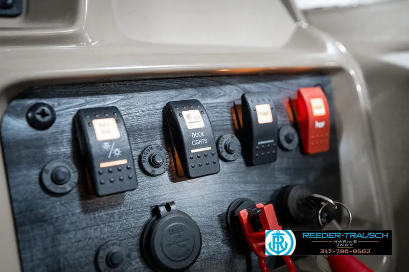 Slide: The Image of Control panel of 2024 SunChaser 16 Vista boat with switches and USB port. - 32